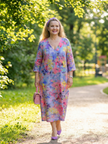 FJØRNA women's floral summer midi dress with long sleeves, flowy and relaxed fit, ideal for warm weather and casual occasions.