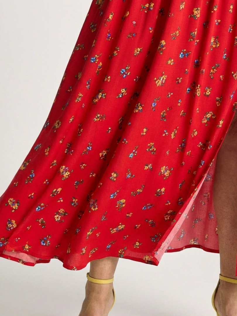 FJØRNA women's summer midi dress with floral pattern, square neckline, and puff sleeves, perfect for warm-weather styling.