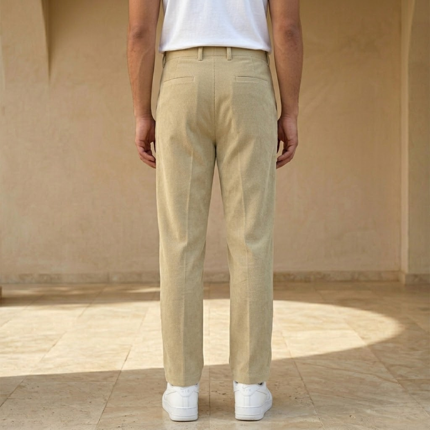 Men’s FJØRNA straight leg corduroy trousers, casual style, in a natural beige color, showing the fit and texture of the fabric.