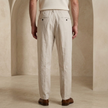 Men’s linen blend trousers by FJØRNA, lightweight casual summer pants in neutral fabric, displayed on a model.