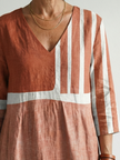 FJØRNA summer midi dress for women with striped pattern, long sleeves, and flowy fit, perfect for warm weather.