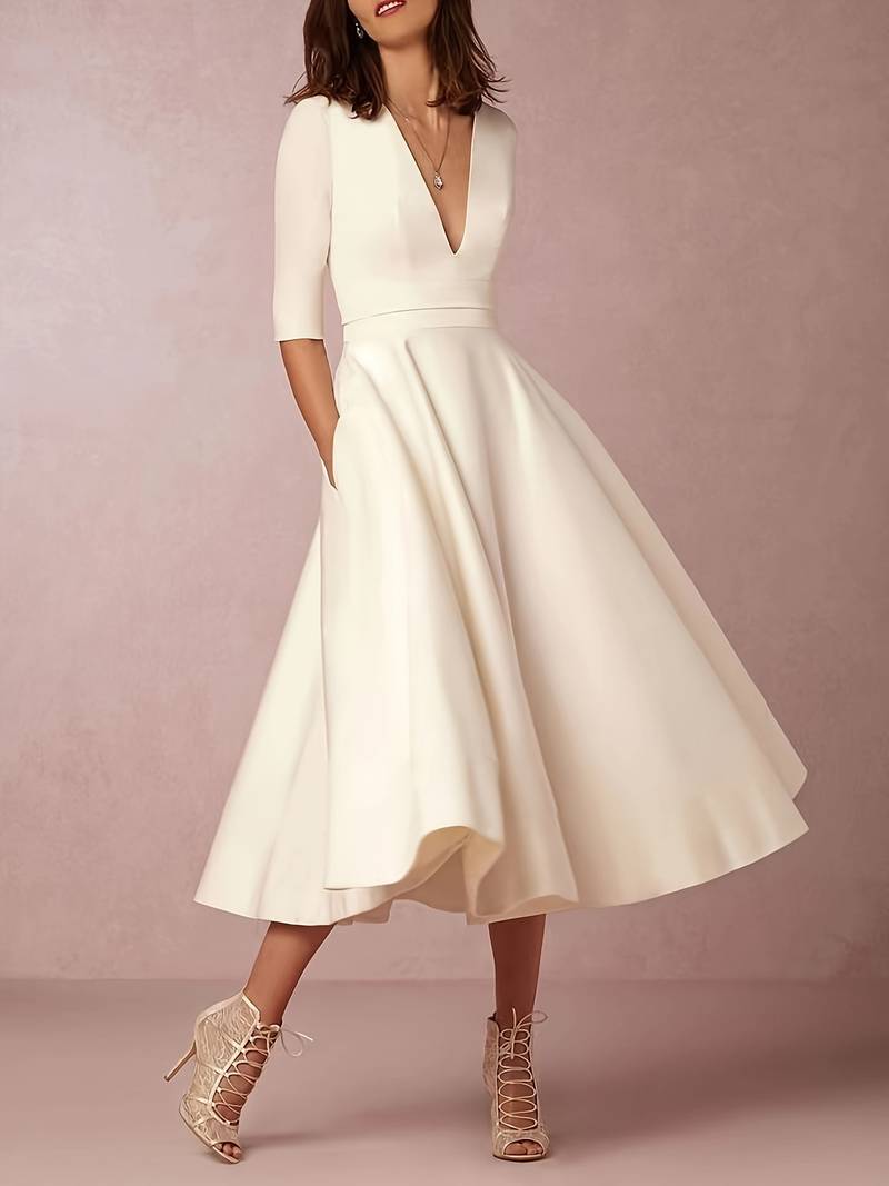 Navy FJØRNA wedding guest flared midi dress for women, elegant and stylish for special occasions and celebrations.