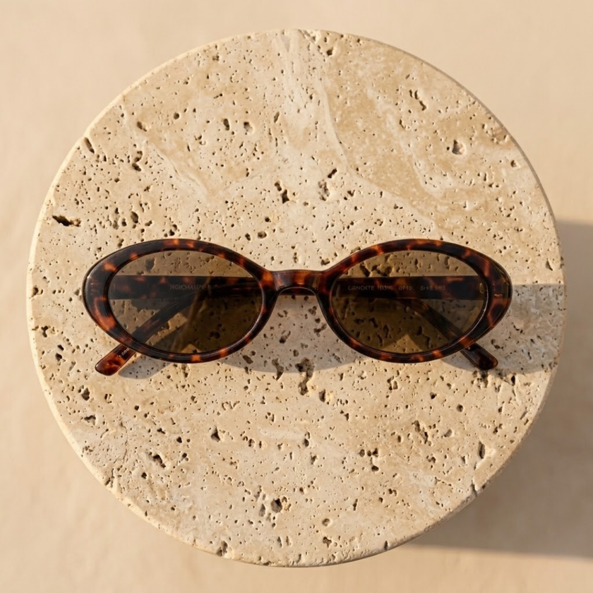 Retro oval sunglasses for women by FJØRNA, stylish unisex accessories with dark tinted lenses and a vintage-inspired frame.