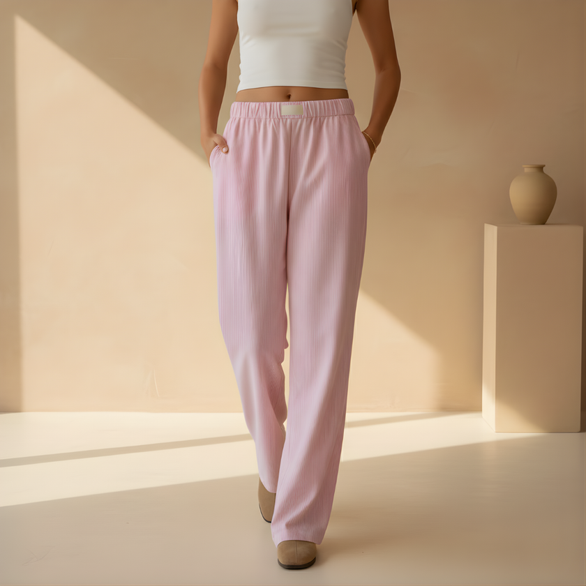 FJØRNA women's lounge trousers with elastic waist and side pockets, relaxed fit, soft fabric for comfortable casual wear.