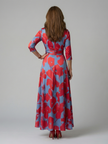 FJØRNA women's floral summer maxi dress with V-neck wrap style, flowing fabric, perfect for warm-weather occasions.