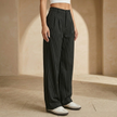Women’s FJØRNA pinstripe wide-leg high-waisted trousers, front view showing tailored fit and crisp pinstripe pattern.