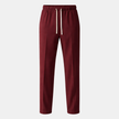 Men's wide-leg FJØRNA joggers with drawstring waist, relaxed fit, and comfortable fabric, shown on a model.