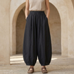FJØRNA linen blend harem trousers for women with elastic waist, relaxed fit, and stylish comfortable design.