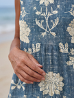 FJØRNA women's floral sleeveless wrap midi dress with a flowy design, perfect for summer occasions.