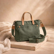 Large canvas messenger bag for women by FJØRNA, featuring adjustable strap and spacious interior for everyday use.
