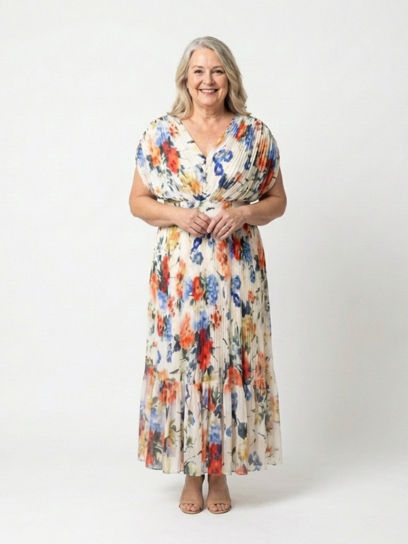 FJØRNA women's floral pleated summer midi dress with a flowing, lightweight fabric, perfect for warm-weather occasions.