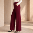 FJØRNA women's high waist wide leg tailored trousers, showing the fit and fabric texture of the stylish pants.