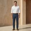 Men's linen blend straight leg trousers by FJØRNA, tailored fit with crisp fabric and classic design, shown in a neutral color.