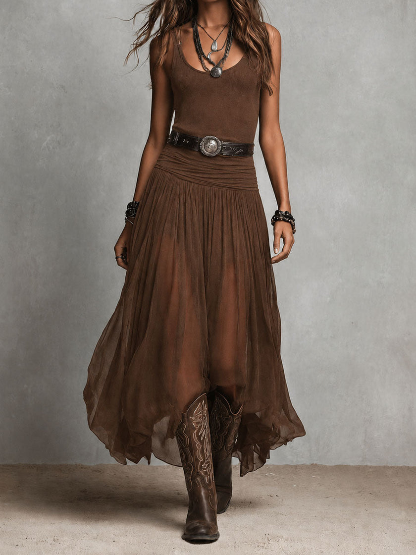 FJØRNA black maxi dress, casual style, full-length dress with sleeveless design and flowing fabric, on a model.