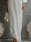 Women's ivory white cotton-linen blend mini dress by FJØRNA, featuring a lightweight, breathable fabric and a stylish, casual silhouette.