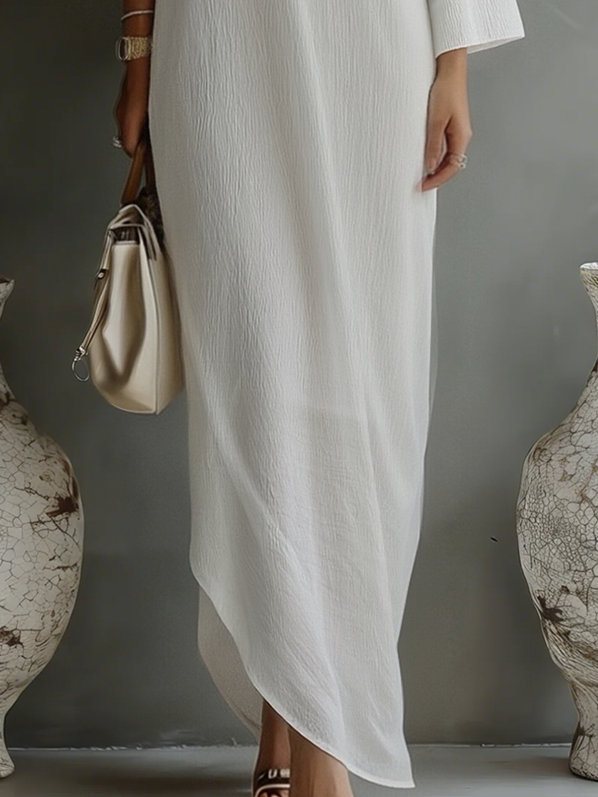 Women's ivory white cotton-linen blend mini dress by FJØRNA, featuring a lightweight, breathable fabric and a stylish, casual silhouette.