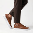 FJØRNA men's leather lace-up low-top sneakers with stylish design and durable black leather upper.
