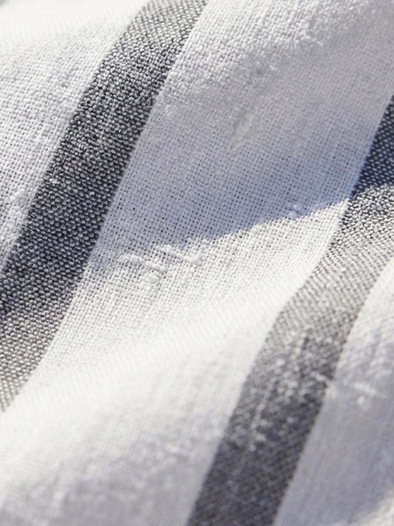 FJØRNA women's summer midi dress with short sleeves and blue and white striped pattern, lightweight and stylish for warm weather.