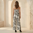 FJØRNA women's two-piece suit set with wide-leg tropical print, featuring a stylish top and matching pants.