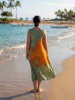 FJØRNA women's sleeveless print summer midi dress with wrap design, featuring a flowy silhouette and vibrant floral pattern.