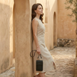 FJØRNA women's crossbody bag with adjustable strap and sleek design, made of durable material for everyday use.