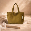 Large FJØRNA corduroy tote bag for women with spacious interior and durable handles, stylish and functional for everyday use.