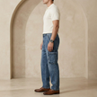 FJØRNA men's elastic waist jeans showing classic denim fabric, front pockets, and a relaxed fit style.