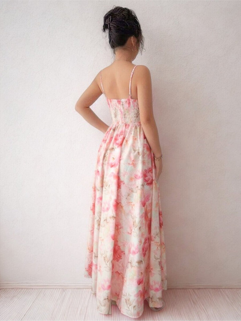 White sleeveless V-neck corset gown by FJØRNA featuring a flowing maxi dress silhouette and elegant design.