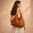 Large FJØRNA leather bag for women with spacious design and stylish appearance, showcasing the textured leather material.