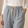 FJØRNA women's cotton linen trousers with drawstring waist, relaxed fit, lightweight and casual for comfortable everyday wear.