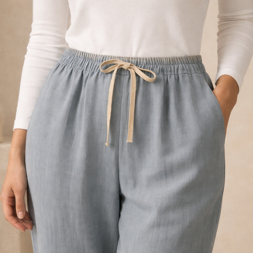 FJØRNA women's cotton linen trousers with drawstring waist, relaxed fit, lightweight and casual for comfortable everyday wear.