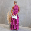 FJØRNA elegant women’s maxi dress with halter neck and ruffle details, flowing fabric and sleeveless design.