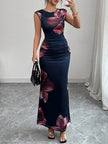 FJØRNA white sleeveless bodycon maxi dress with contrast color flower print and round neckline, perfect for summer occasions.