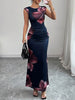 FJØRNA white sleeveless bodycon maxi dress with contrast color flower print and round neckline, perfect for summer occasions.