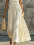 Cream chiffon pleated maxi dress by FJØRNA, casual dress with flowy fabric and elegant pleats, perfect for warm-weather occasions.