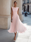 FJØRNA sleeveless pleated midi dress with draped neckline, flowing fabric, and elegant design perfect for formal occasions