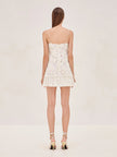 FJØRNA Blanc Rosette-detailed Georgette mini dress with delicate rosette embellishments and flowing fabric, perfect for elegant occasions.