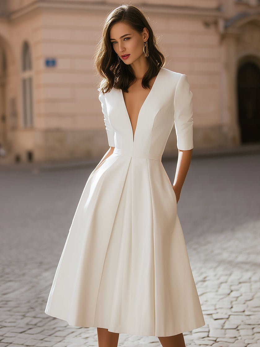 FJØRNA elegant deep V-neck pleated A-line midi dress with flowy fabric and stylish design, perfect for formal occasions.
