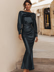 FJØRNA elegant draped satin long sleeve maxi dress displayed on a model, featuring a flowing silhouette and sophisticated design.