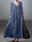 FJØRNA loose V-neck cotton and linen dress in a casual wedding style, featuring a relaxed fit and lightweight fabric.