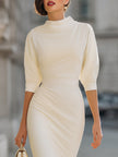 Cream turtleneck puff-sleeve midi dress by FJØRNA, short sleeve design with a fitted silhouette and elegant midi length.