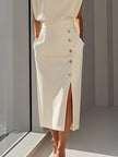 FJØRNA high waisted split-front maxi dress with elegant design and flowing fabric, perfect for formal occasions.