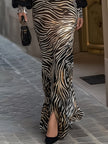 Black sheer sleeve zebra print maxi dress by FJØRNA, flowing design with bold animal print and elegant sheer sleeve details.