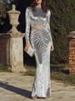 FJØRNA long sleeve ruched cutout evening gown, elegant maxi dress with fitted sleeves and stylish design.