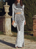 FJØRNA long sleeve ruched cutout evening gown, elegant maxi dress with fitted sleeves and stylish design.