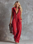 Raspberry red cotton hooded zip-front jumpsuit by FJØRNA, featuring a relaxed fit and front zipper, casual and comfortable.
