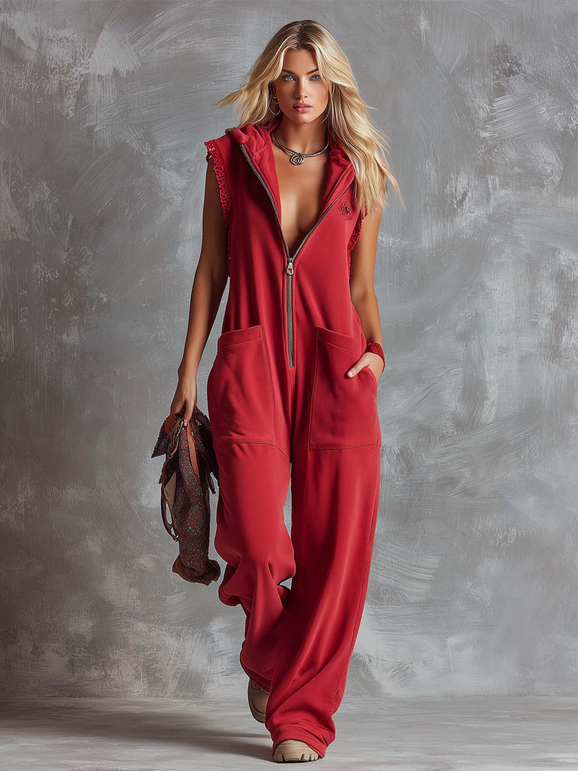 Raspberry red cotton hooded zip-front jumpsuit by FJØRNA, featuring a relaxed fit and front zipper, casual and comfortable.