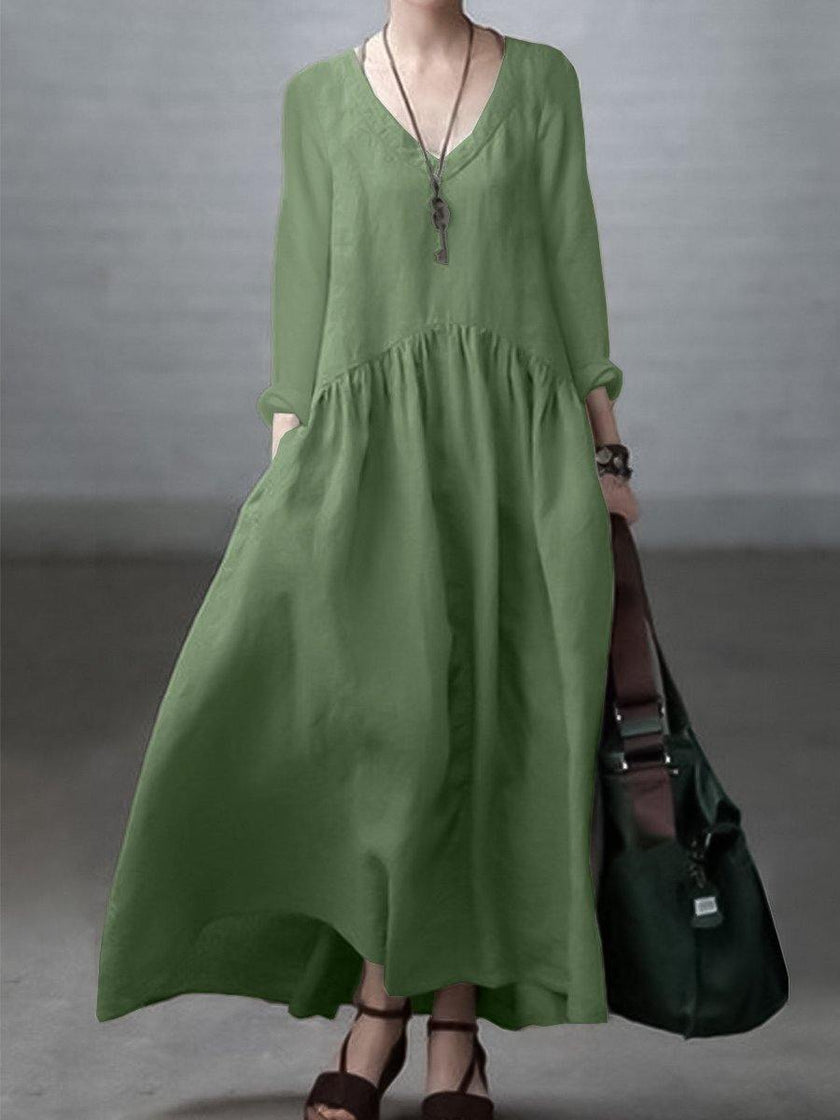 FJØRNA casual cotton and linen V-neck dress with loose fit, perfect for wedding or casual occasions, shown in soft natural fabric.
