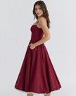 Women's FJØRNA corset midi dress with a tulle skirt, featuring a fitted bodice and flowing layered tulle for elegant style.