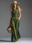 FJØRNA green sleeveless jumpsuit with stand collar and front zipper, tailored fit, and stylish design.